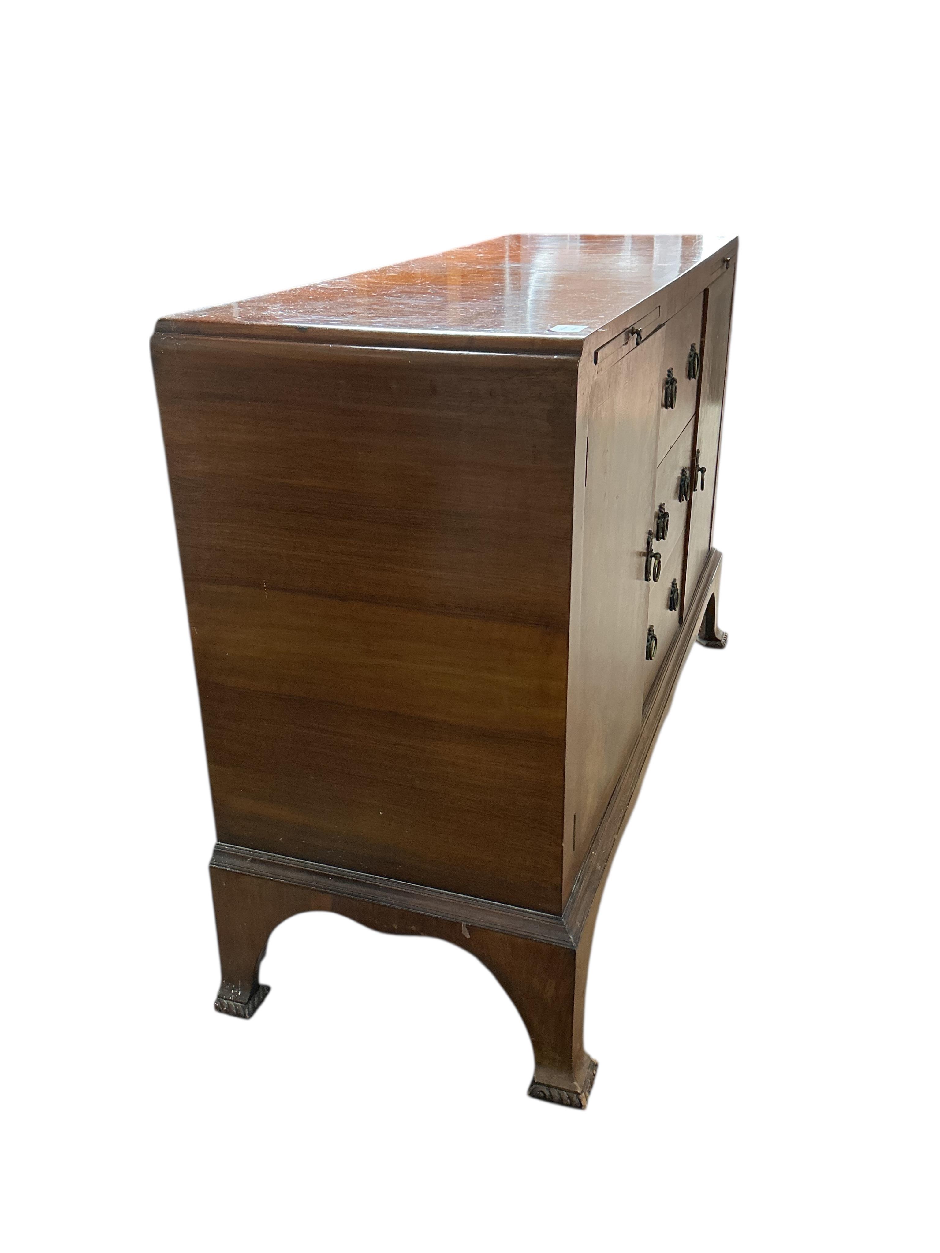 A 1930’s walnut sideboard, width 132cm, depth 46cm, height 90cm